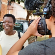 Rose films an interview with Mike Wargo and cameraman Jacob Griswold.