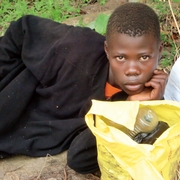 Child Laying On The Ground